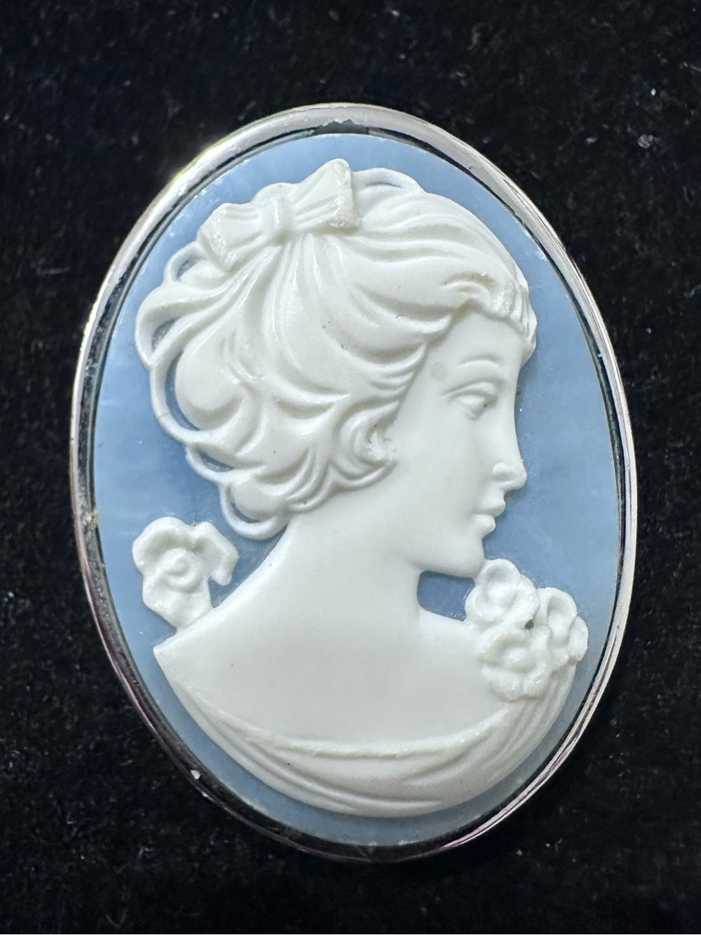 364 - Trifari Classic White Cameo Brooch on Light Blue Background